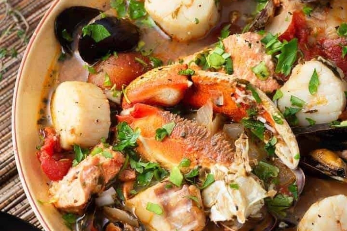 A feast of seafood stew with clams and mussels.