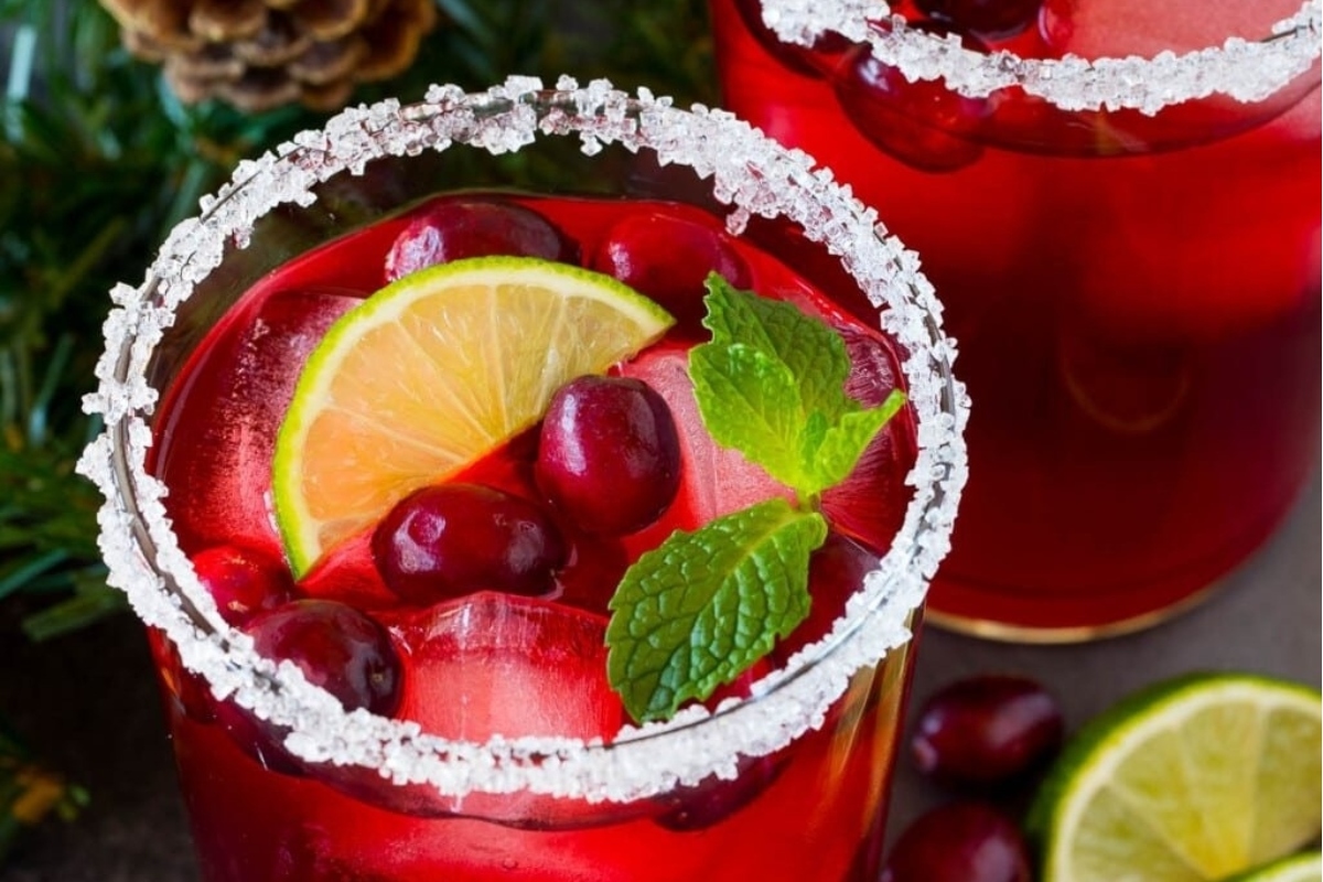 New Year's Eve cranberry margarita with lime garnish.