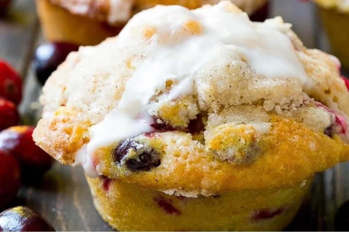 Delicious cranberry muffins topped with a sweet icing and bursting with juicy cranberries.