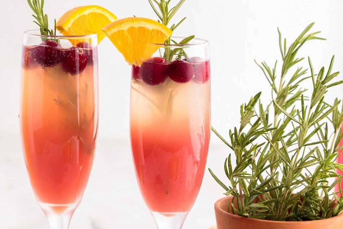 Two glasses of cranberry sangria with rosemary sprigs, perfect for Christmas cocktails.