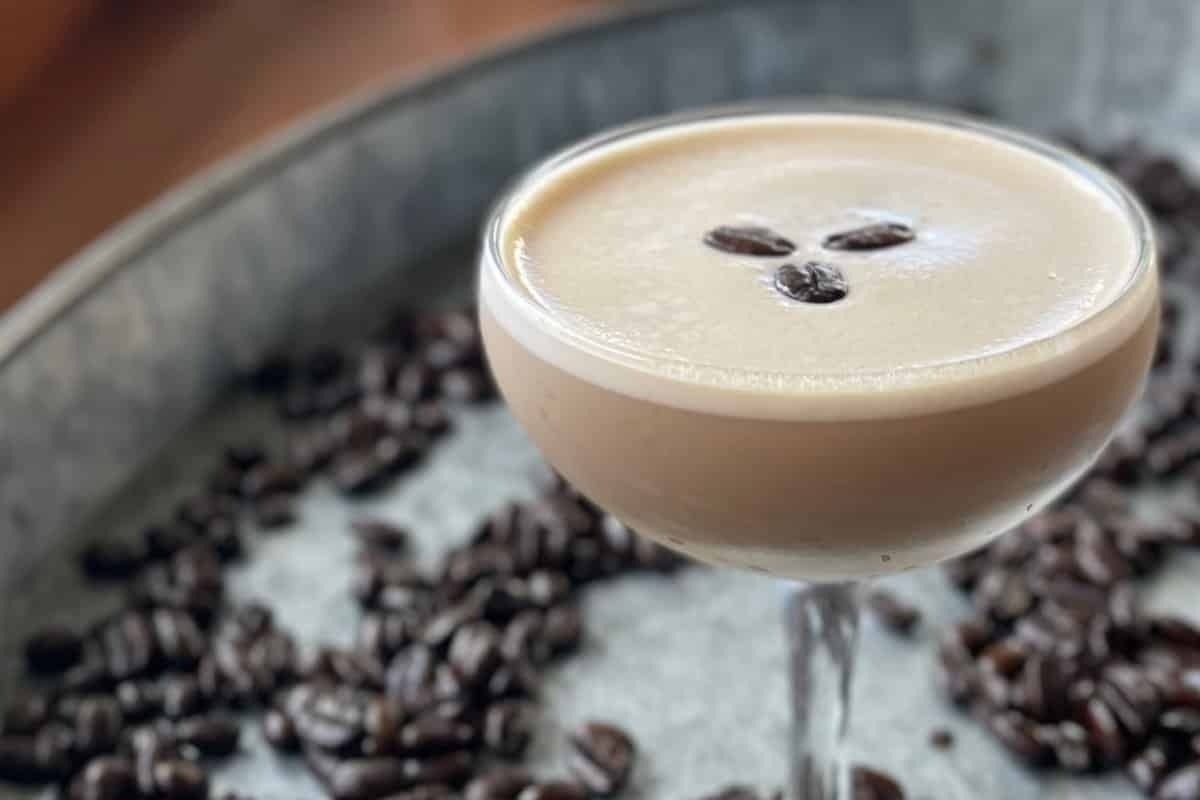 New Year's Eve cocktail featuring coffee beans in a glass.