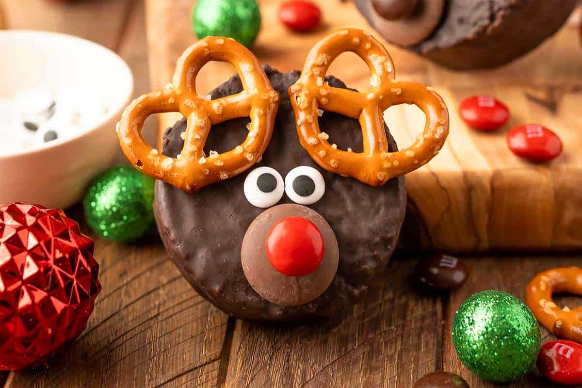 Reindeer cakes adorned with pretzels and Christmas decorations.
