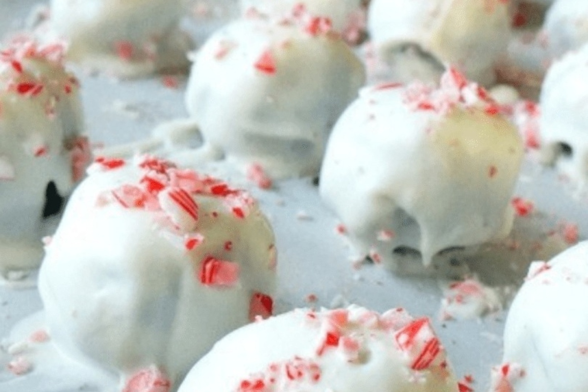 No bake white chocolate peppermint truffles on a baking sheet for Christmas desserts.