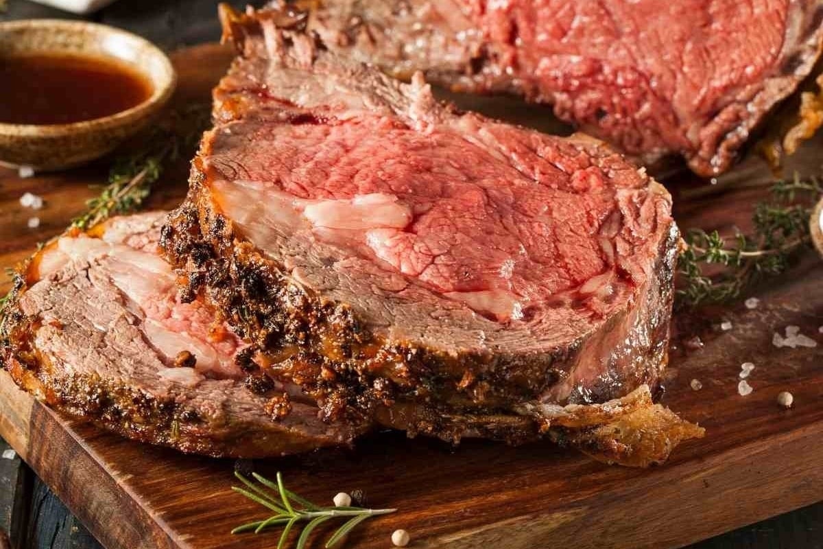 A succulent beef roast, perfectly cooked and resting on a sturdy wooden cutting board, is the centerpiece of New Year's dinners.