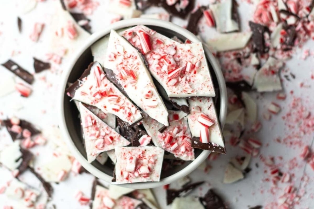A delectable display of peppermint bark beautifully presented in a white bowl.