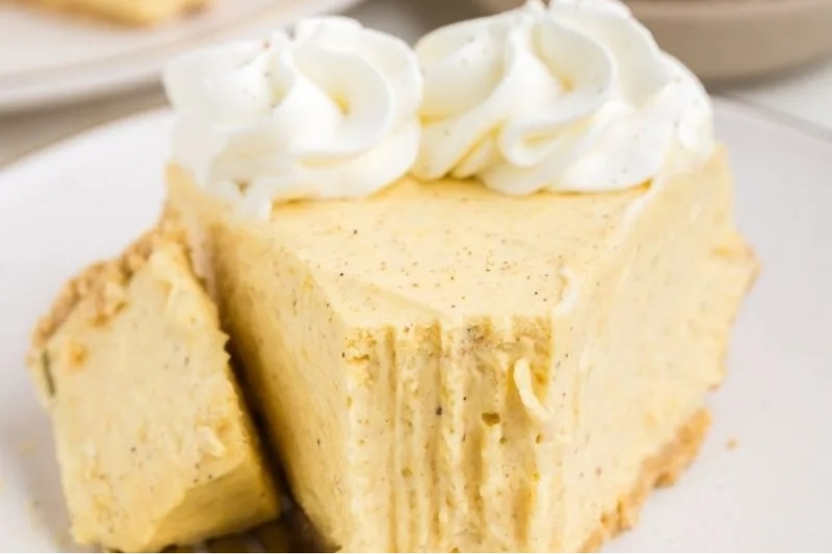 A make-ahead slice of pumpkin pie on a plate.