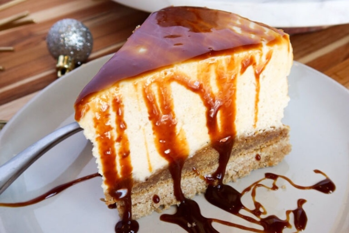 A slice of no bake caramel cheesecake on a plate.