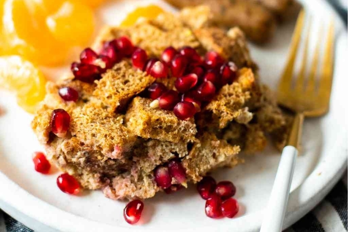 Make a festive holiday dish by preparing a plate of bread pudding infused with the flavors of sweet pomegranate and tangy oranges. This delightful treat can be made ahead of time, allowing you to