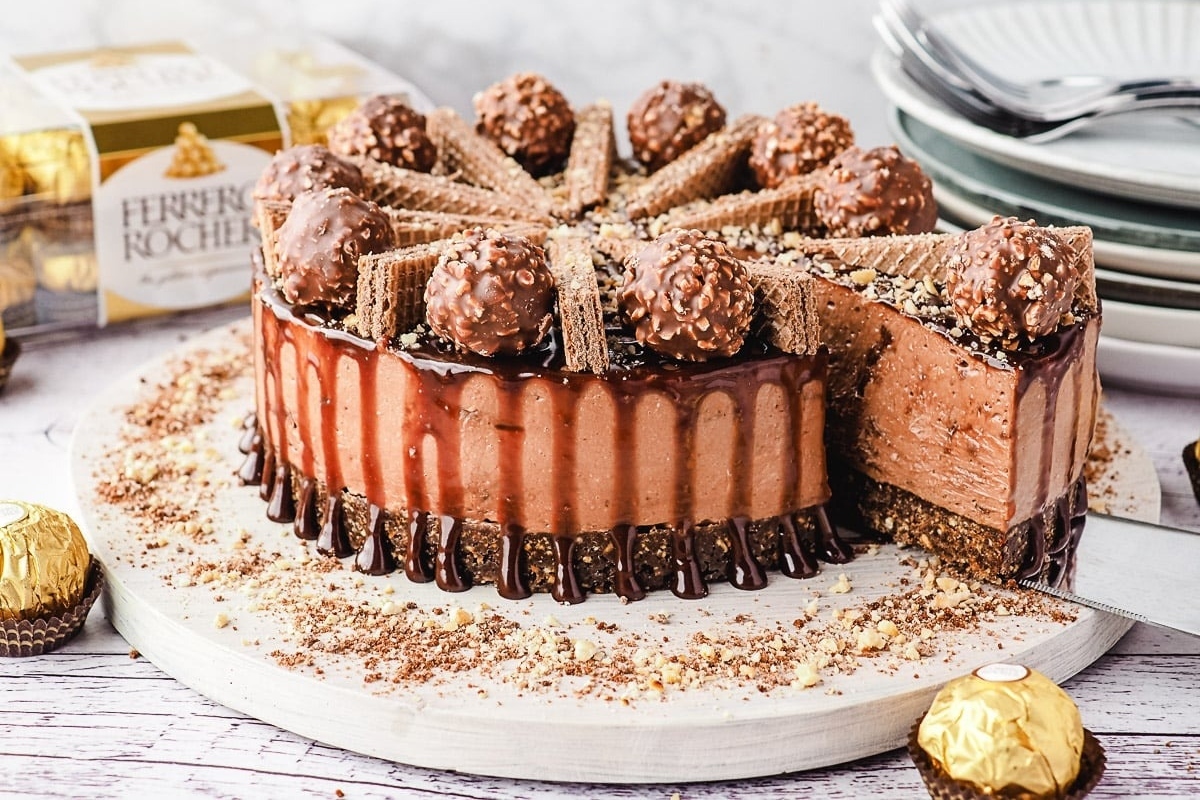 A chocolate cake with a slice taken out of it.