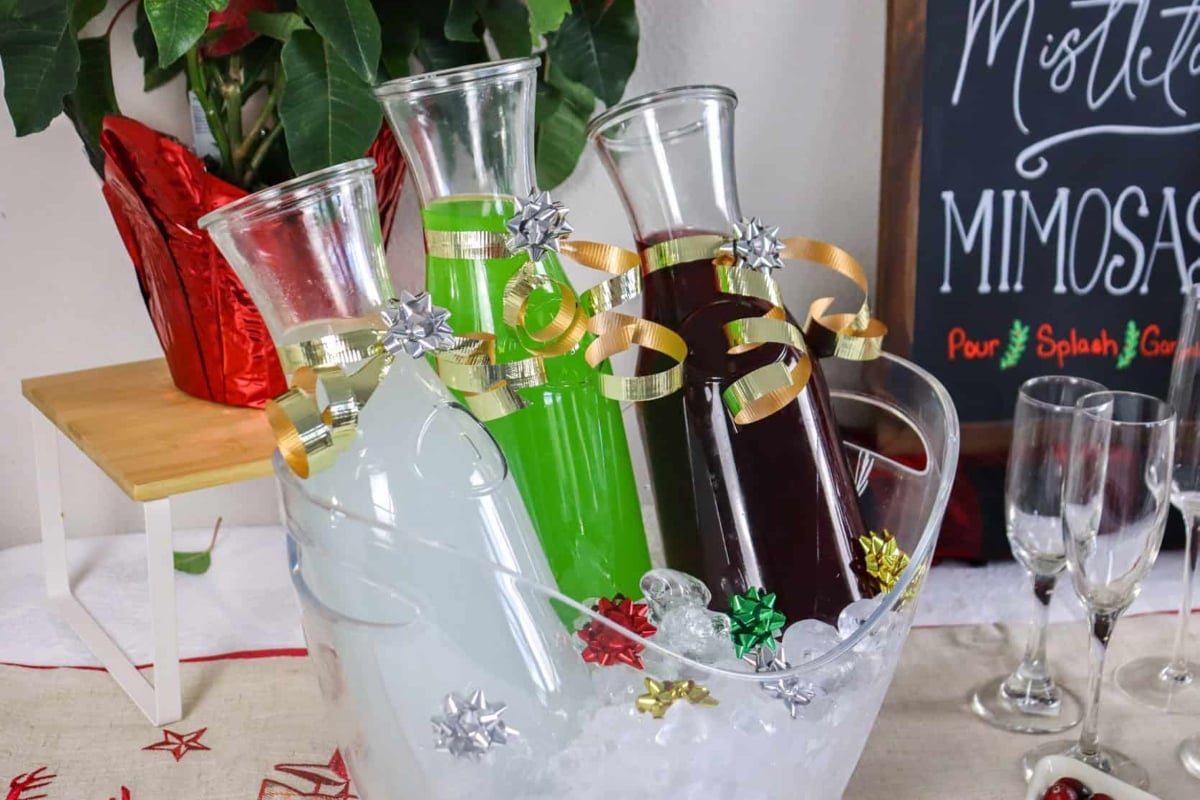 Three glasses of mulled wine in an ice bucket, perfect for a festive Christmas gathering.