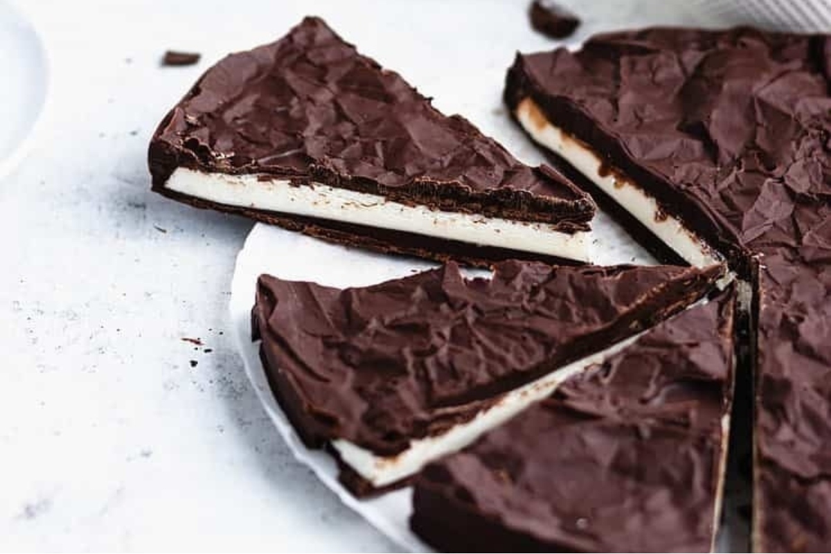 A slice of chocolate ice cream pie on a plate, perfect for peppermint lovers.