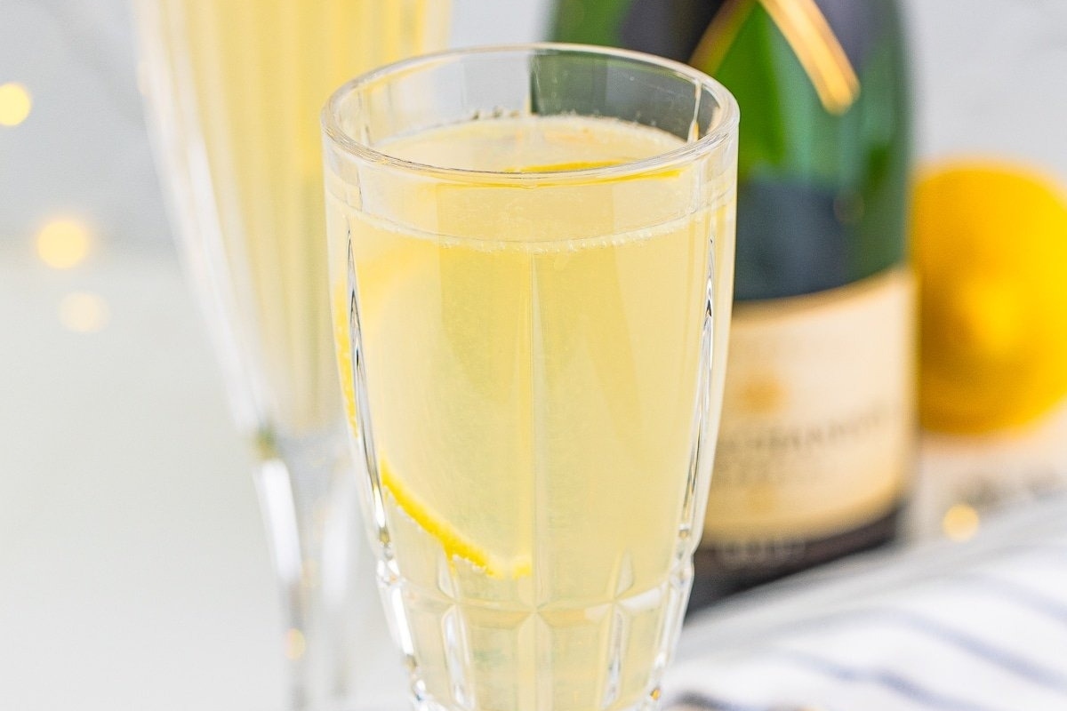 Two glasses of champagne with lemons for Christmas cocktails.