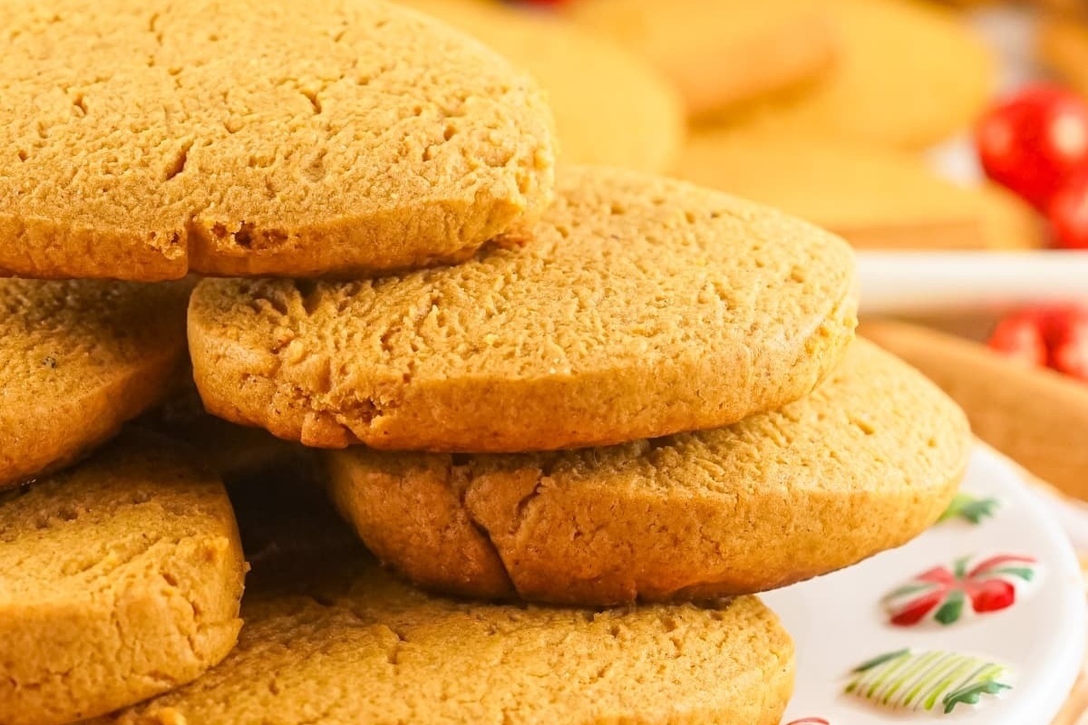 A stack of gingerbread cookies, perfect for freezing, on a plate.