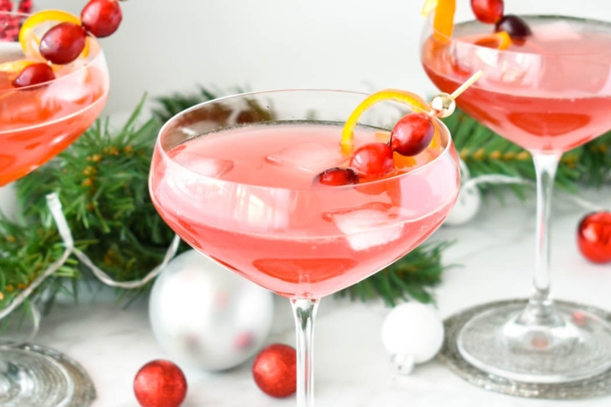 Celebrate New Year's Eve with a festive cranberry pomegranate martini, adorned with a pomegranate garnish.