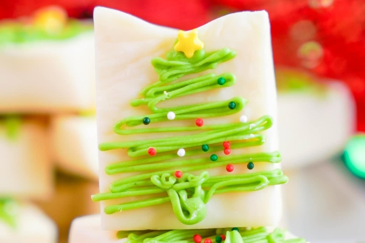 A stack of christmas tree shaped chocolate bars.