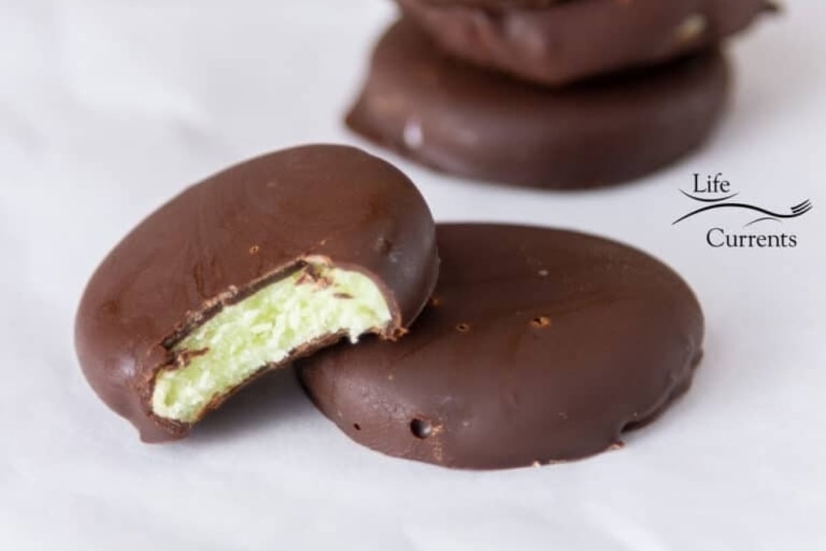 Peppermint chocolate truffles with a bite taken out of them.