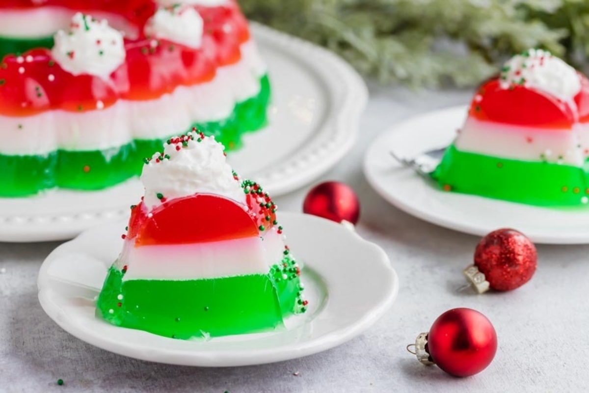 A plate of christmas jello on a white plate.