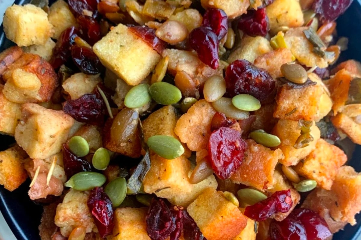 Slow cooker stuffing with cranberries and pumpkin seeds for Christmas.