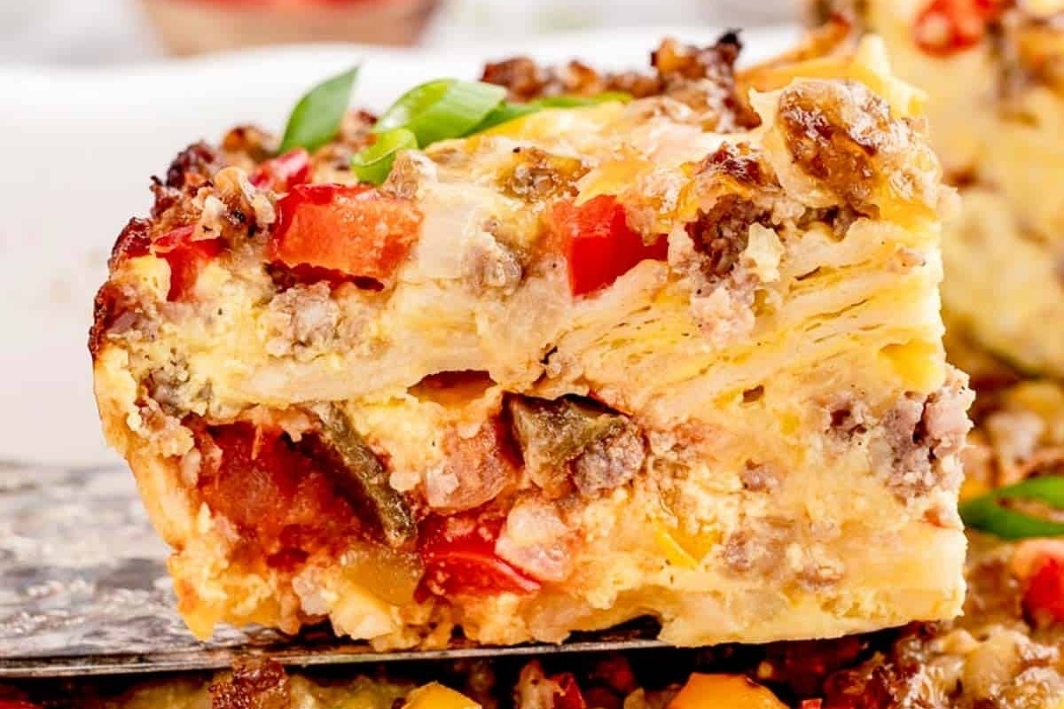 A slice of make ahead breakfast casserole on a plate.