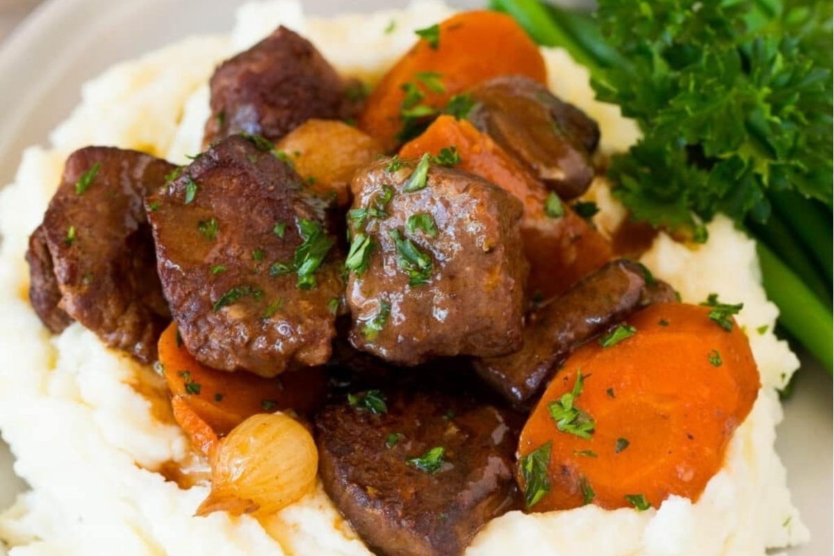 Make ahead beef stew with carrots and mashed potatoes, perfect for holiday dishes.