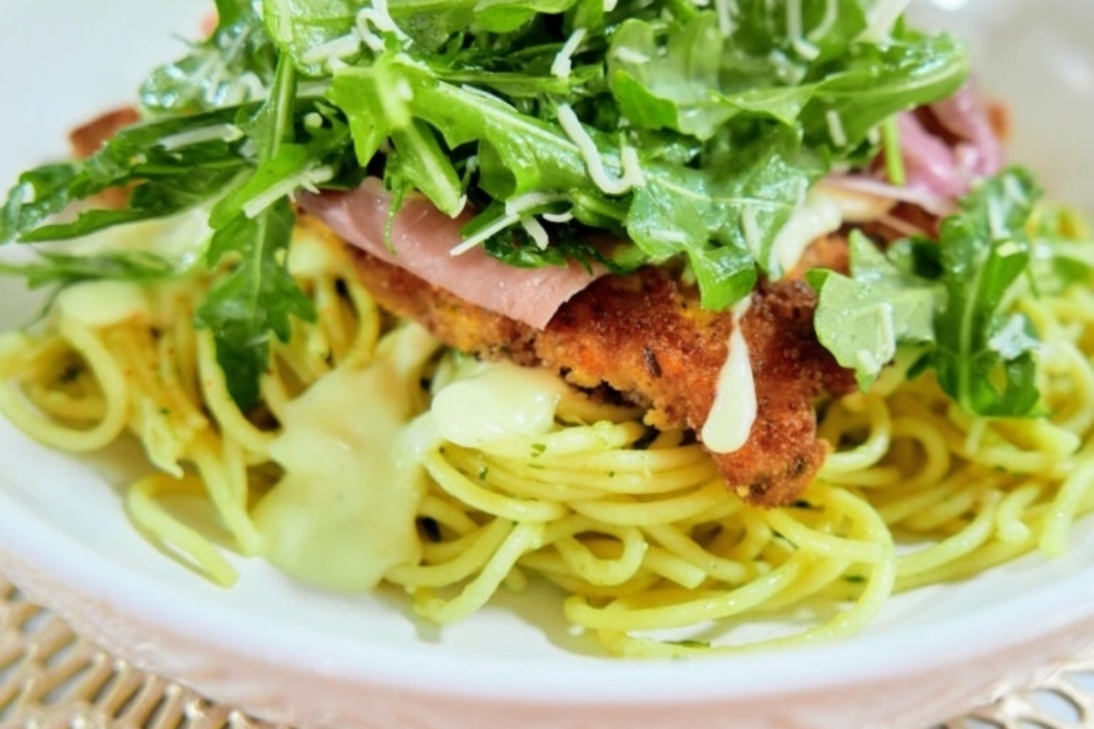 New Year's Eve Meal Idea: A delicious bowl of pasta packed with tender chicken and nutritious greens.