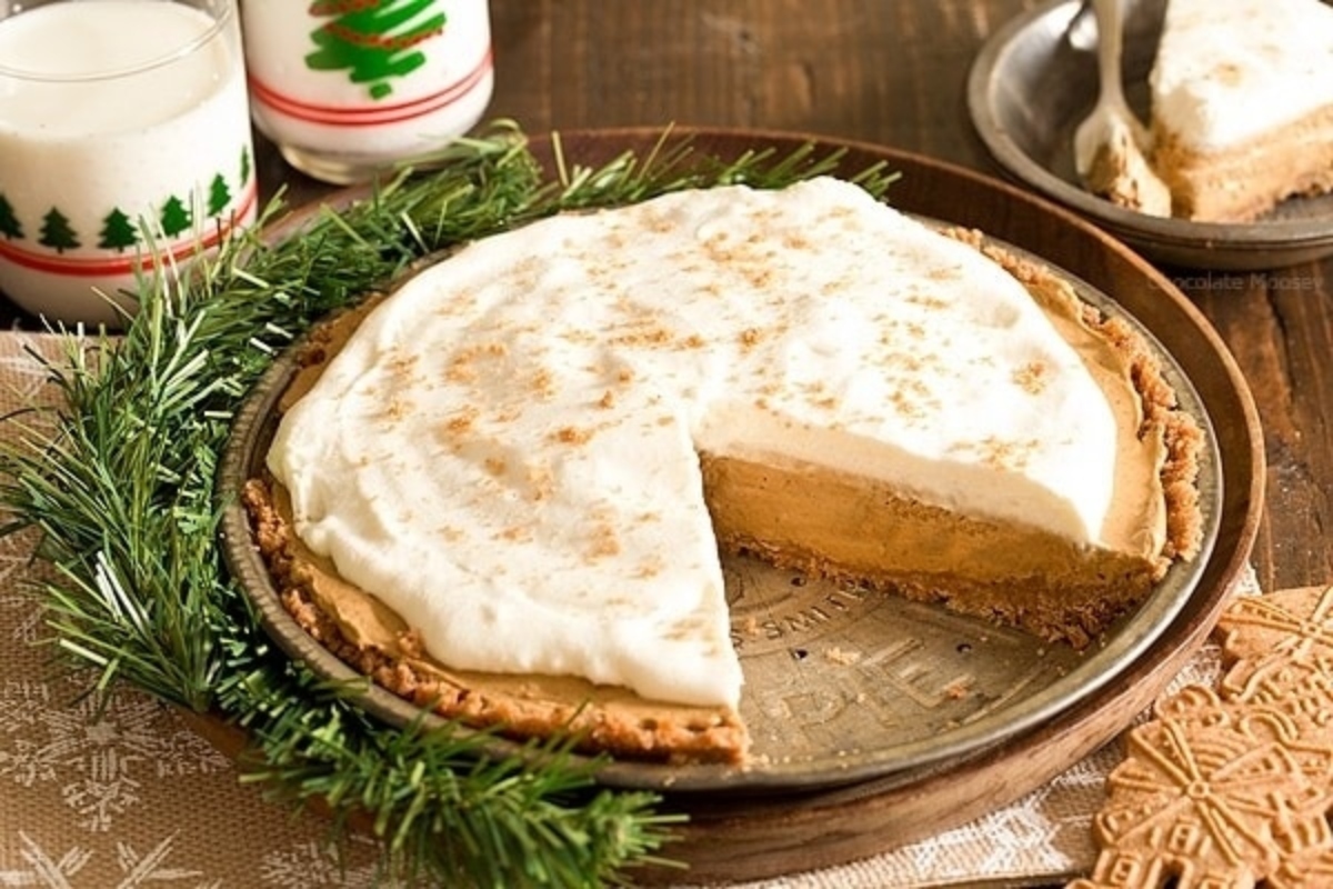 A make ahead holiday dish featuring a delicious pie with a slice taken out of it, beautifully presented on a plate.
