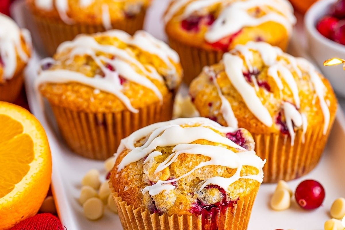 Delicious cranberry orange muffins with a touch of white icing.