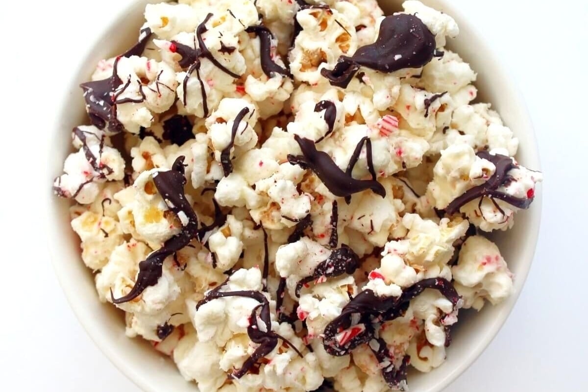 This recipe features a bowl of popcorn with a delightful peppermint drizzle.