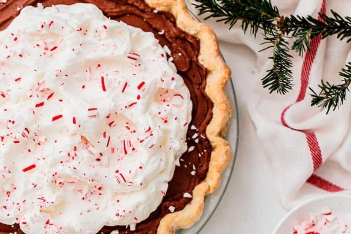 Discover a delectable peppermint pie recipe, featuring rich chocolate filling and a dollop of fluffy whipped cream. Embellished with crushed candy canes for a festive touch, this dessert