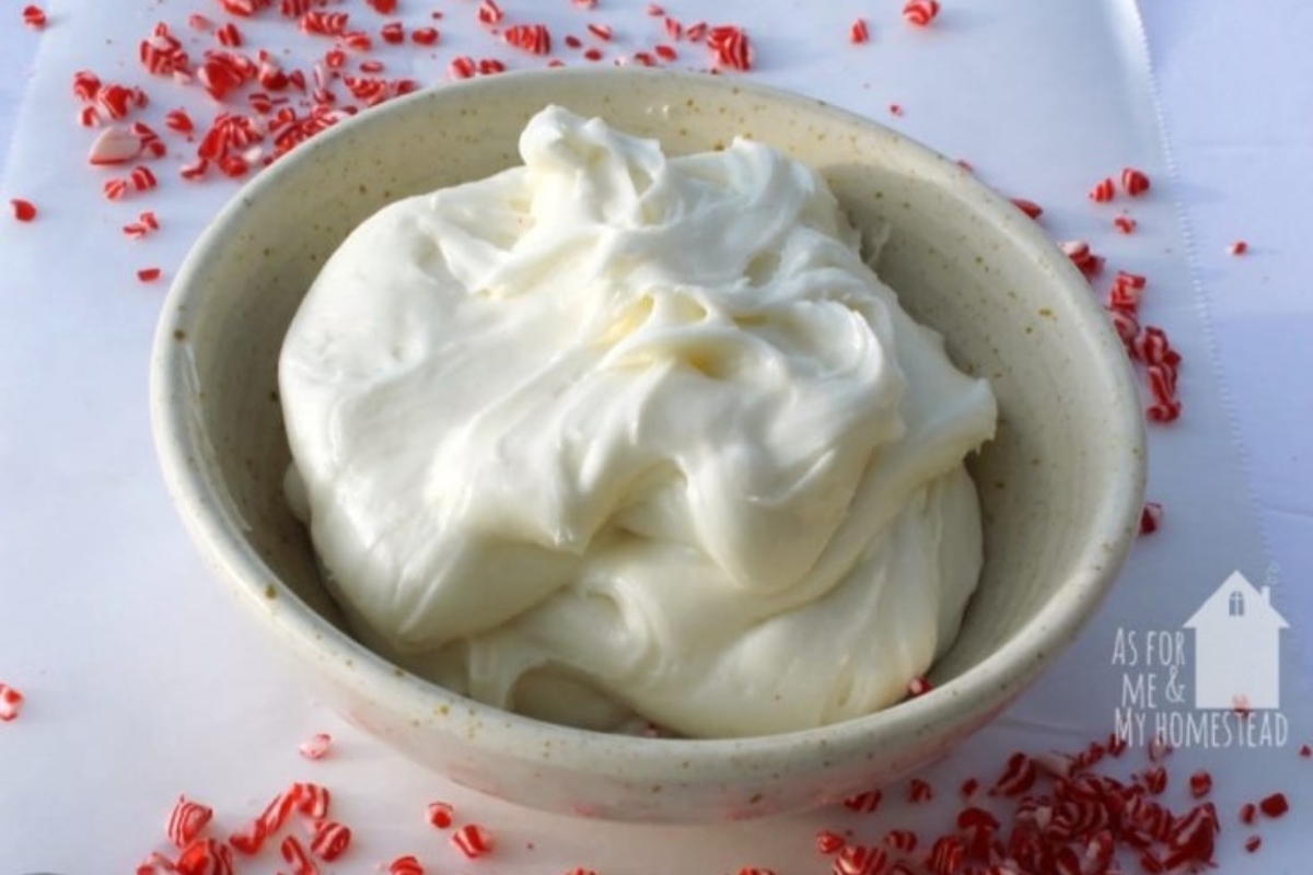 Delicious peppermint-flavored whipped cream with candy canes in a festive bowl.