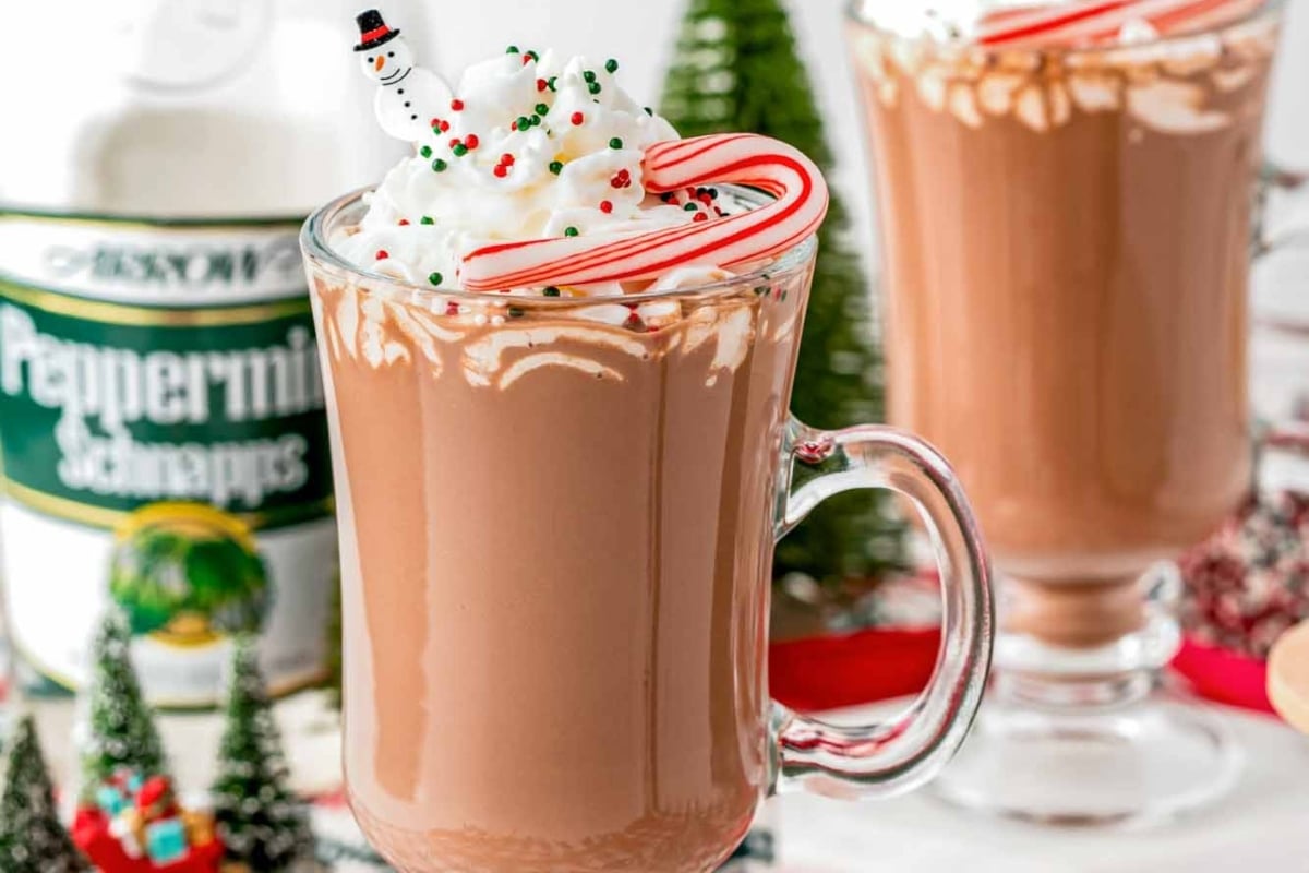 Starbucks holiday beverage featuring peppermint hot chocolate with whipped cream and candy canes.