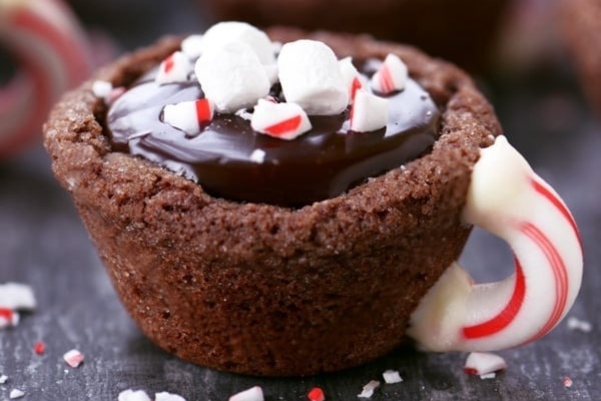 Chocolate mugs garnished with peppermint candy canes.