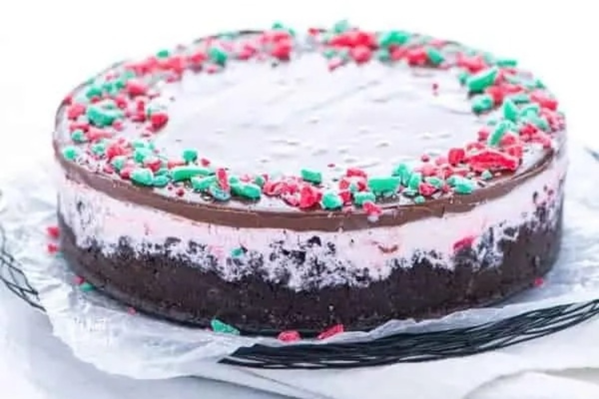 A vibrant Christmas cake adorned with red and green sprinkles.