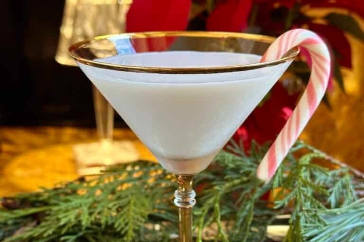 Celebrate your New Year's eve party in style with a festive martini adorned with a delightful candy cane garnish.
