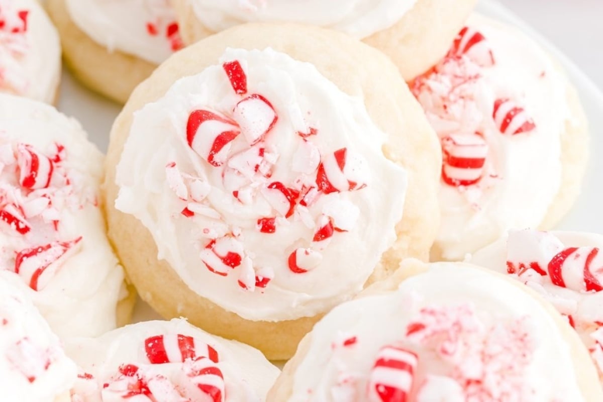A plate of peppermint cookies with whipped cream and candy canes. Looking for some festive peppermint recipes? Look no further as this delectable dish combines the refreshing taste of peppermint