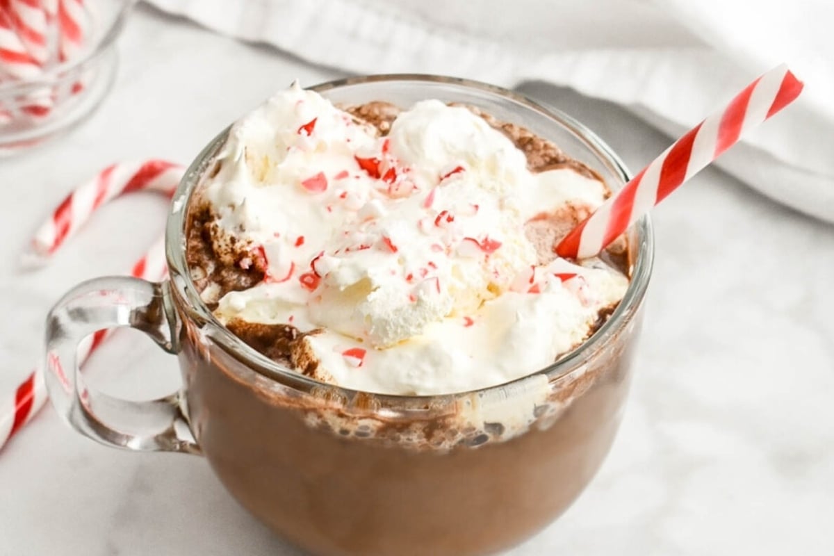 Peppermint hot chocolate with whipped cream and candy canes offers a delightful twist to traditional hot cocoa. Infused with the invigorating flavor of peppermint, this indulgent drink will surely warm
