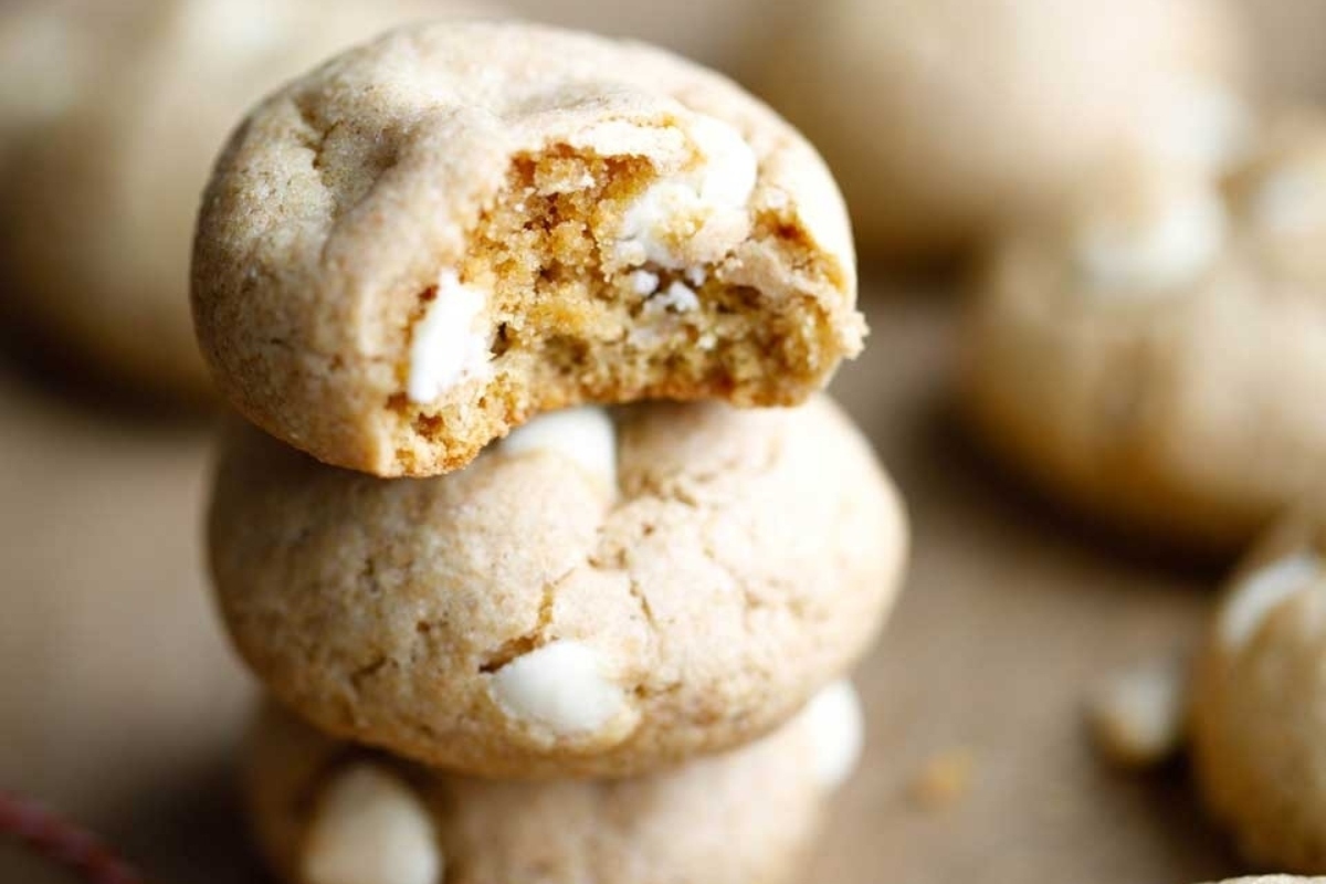 A stack of peppermint cookies with a bite taken out of them.