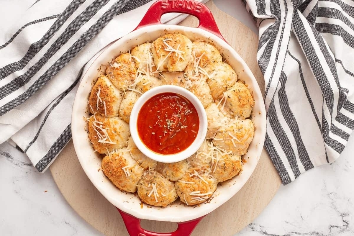 A delectable NYE appetizer featuring a mouthwatering pizza topped with flavorful sauce.