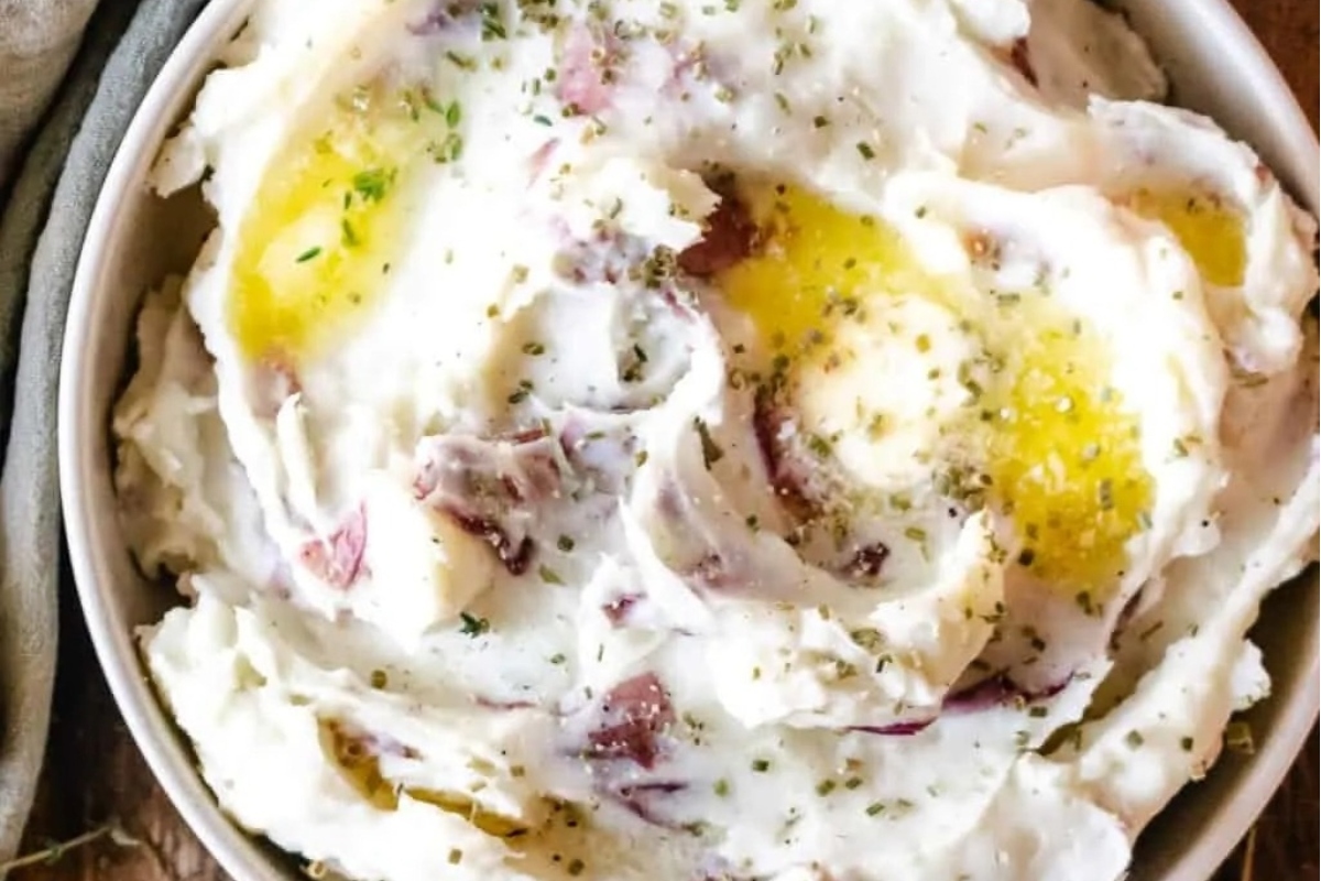 Make-ahead holiday dish of creamy mashed potatoes with eggs and herbs.