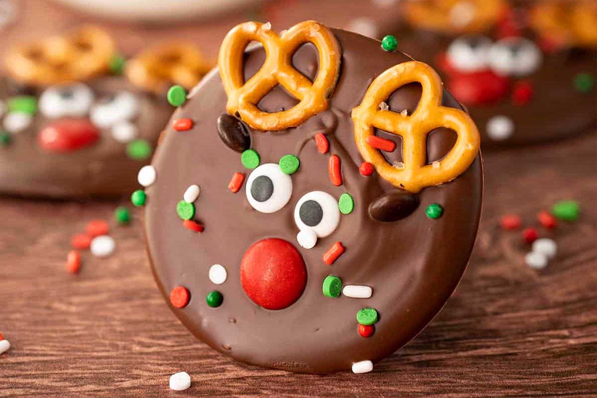 Reindeer treats shaped like chocolate cookies with pretzels on top.