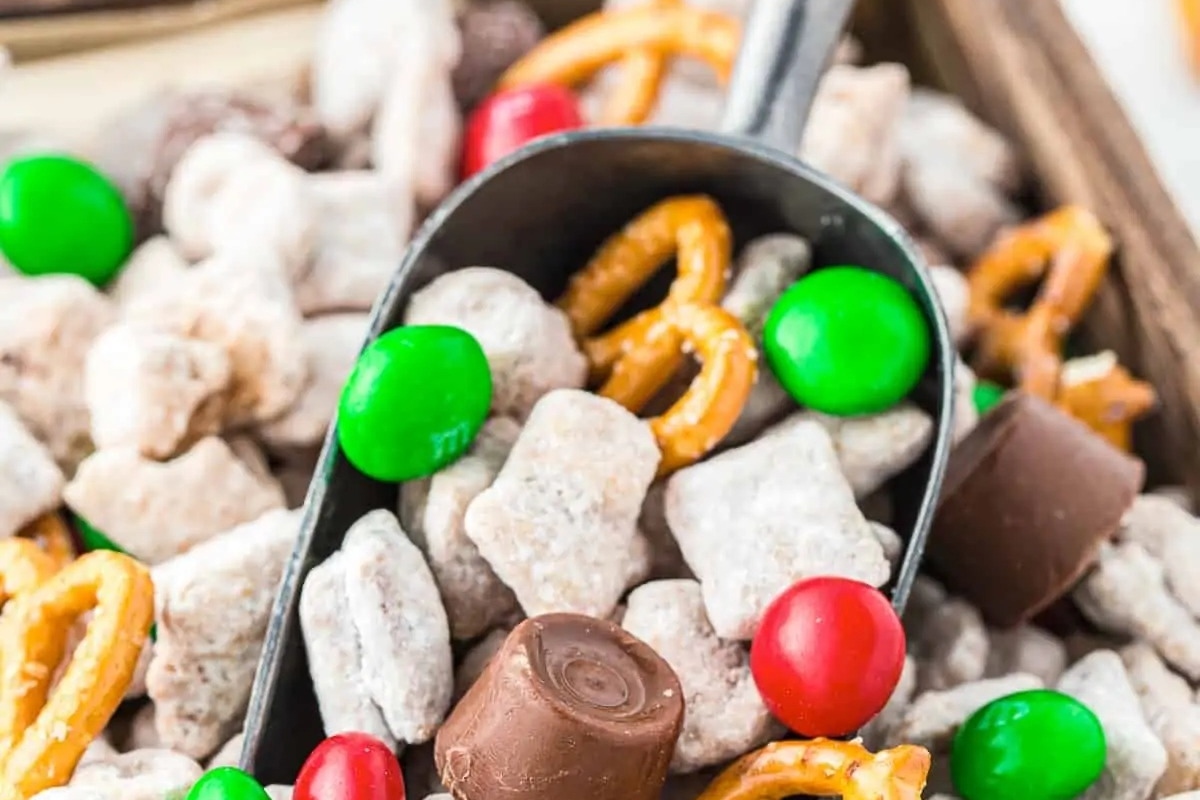 A festive spoonful of delightful candy and pretzels, perfect for quick and easy no bake Christmas desserts.