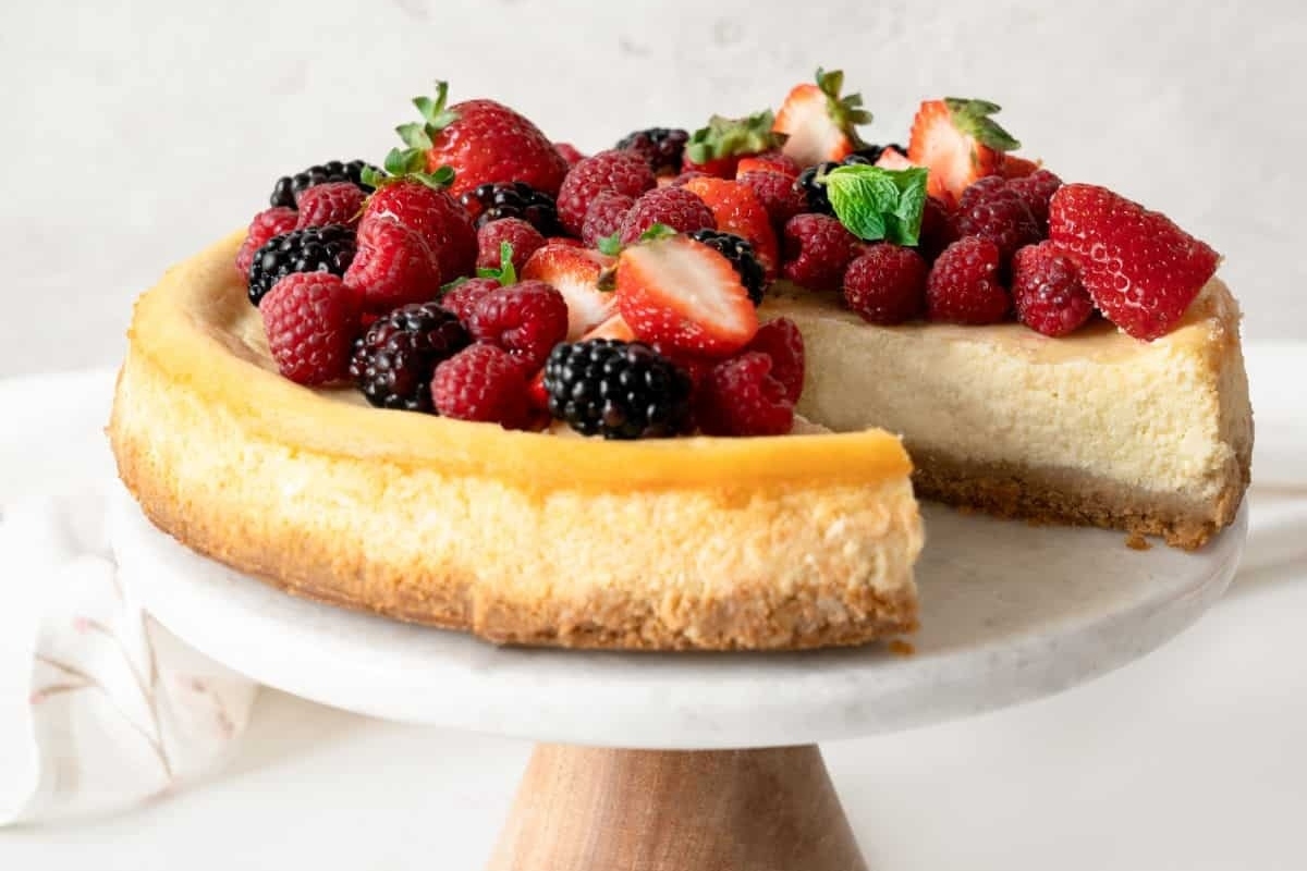 A delectable holiday cheesecake adorned with luscious berries.
