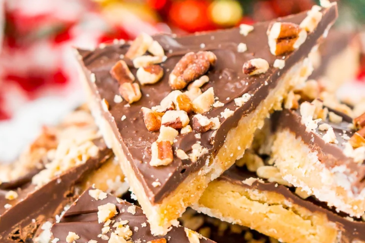 A stack of Christmas bark recipes on a plate.