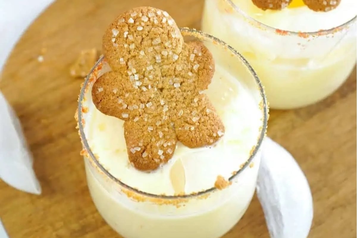 Festive gingerbread margaritas garnished with a gingerbread man.