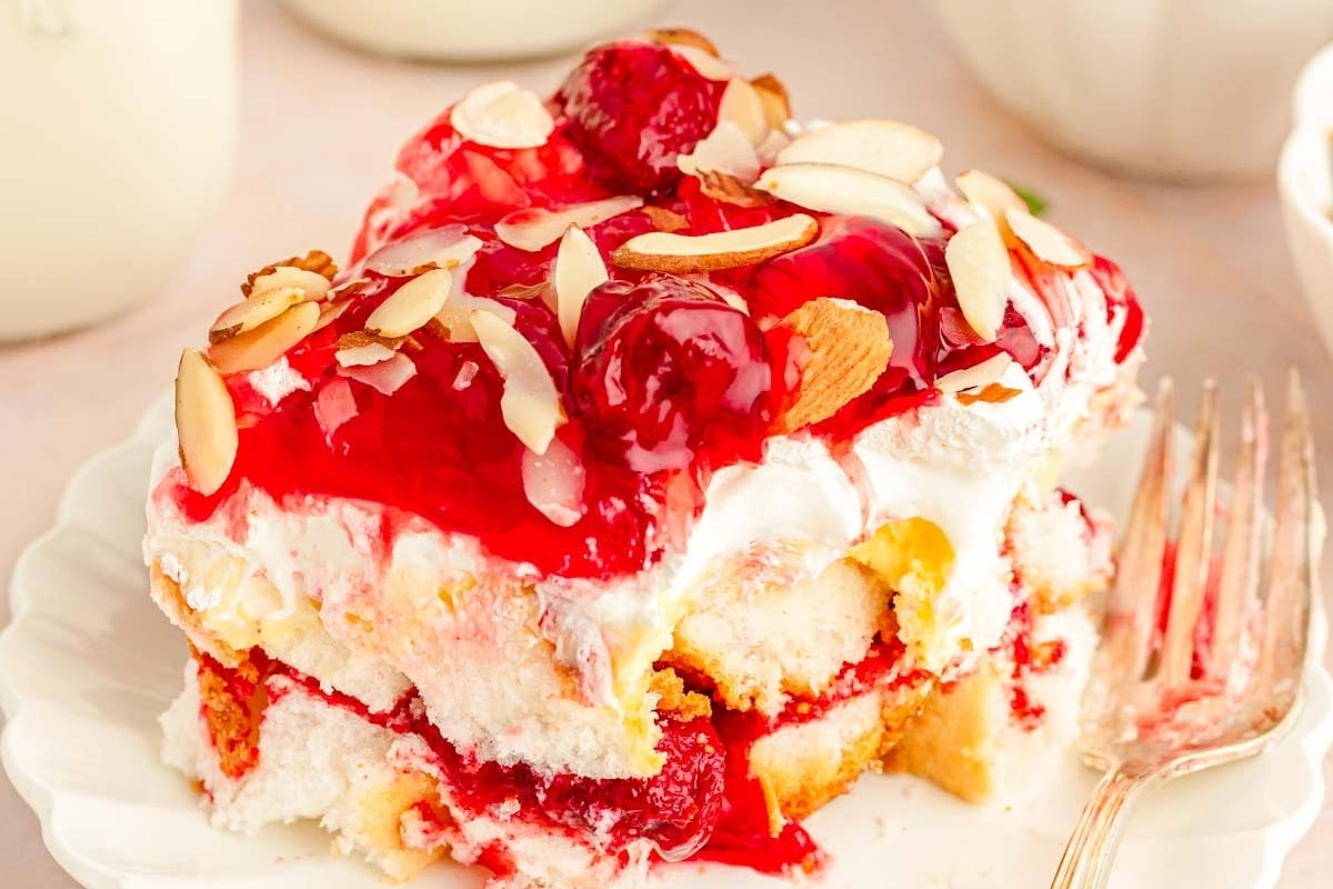 A slice of cherry ice cream cake on a plate, perfect for Christmas.