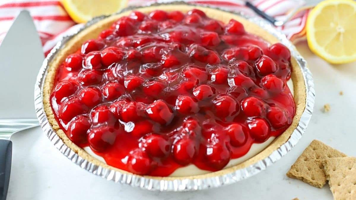 A refreshing no bake dessert of cranberry and lemon pie presented on a plate.