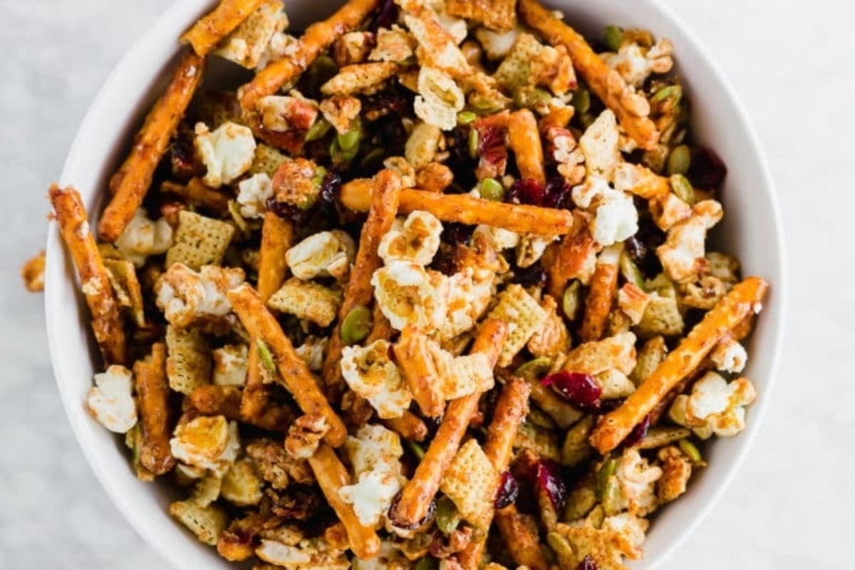 A delightful bowl of cranberry granola snack mix.