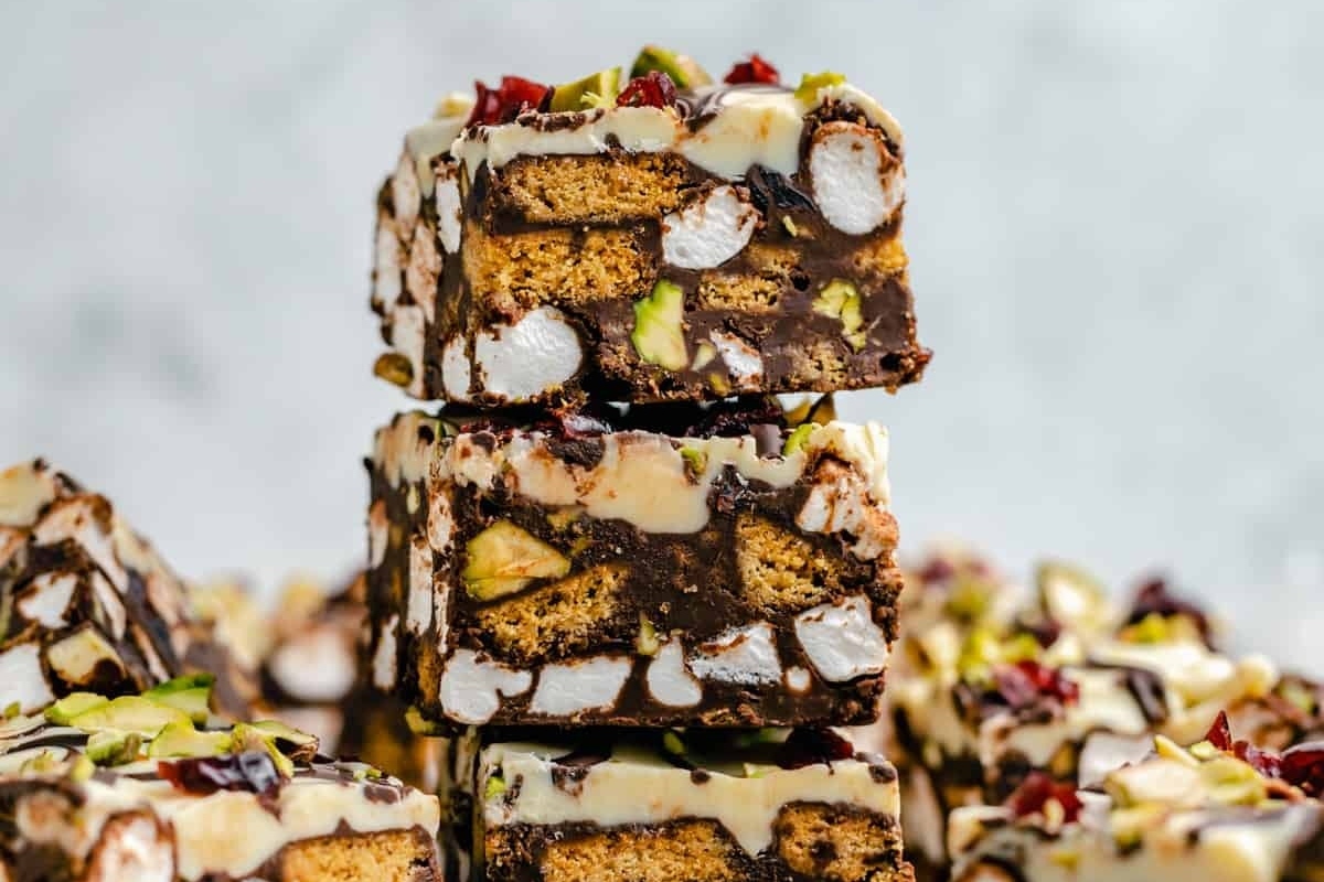 A stack of Christmas-themed fudge made with chocolate and pistachio, requiring no baking.