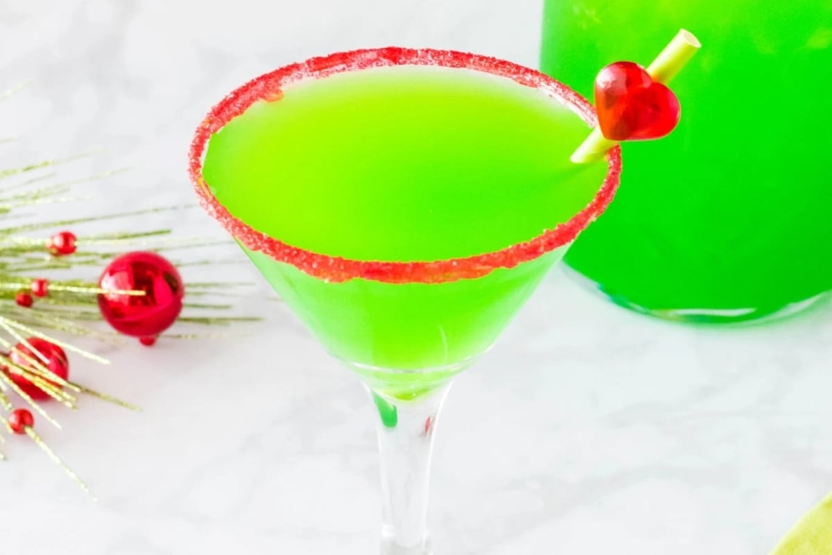 A festive green martini with a cherry on top, perfect for Christmas.