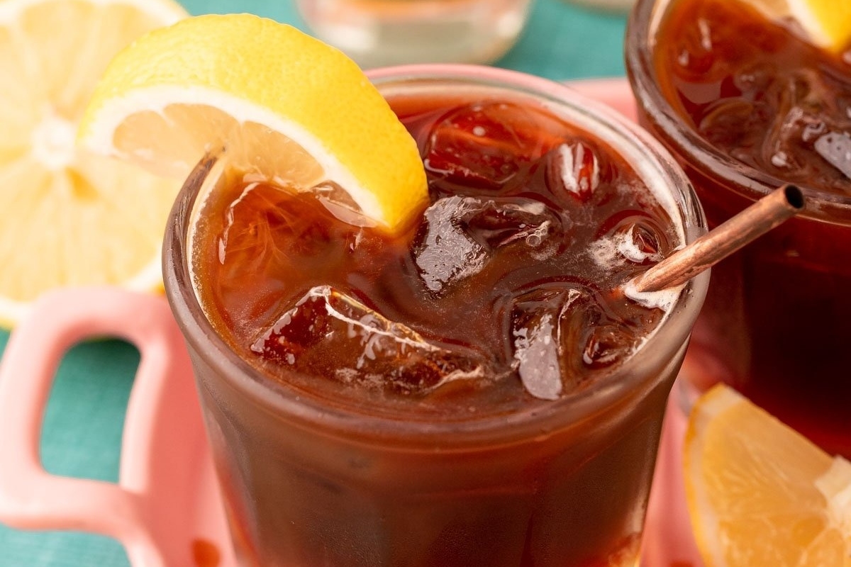 Two glasses of iced tea with lemon wedges, perfect for festive Christmas cocktails.